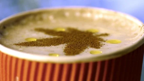 CBD Oil A glass of coffee with a pattern of marijuana cinnamon, a dropp Stock Footage 125835483