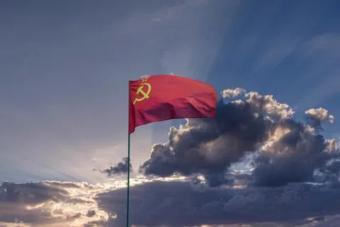 CCCP USSR Soviet Union flag waving in the dramatic cloudy sky Stock Photos