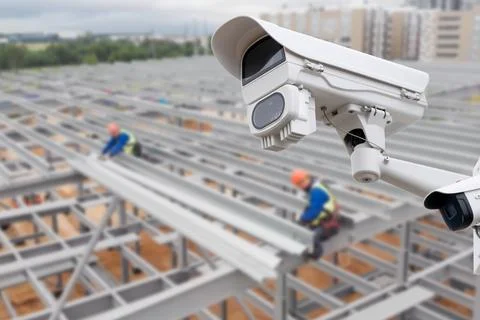 CCTV with Blurring Building construction background. Stock Photos