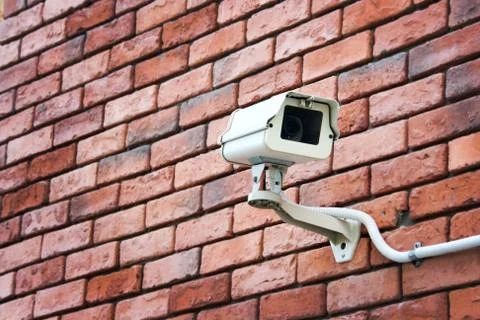 Cctv on the brick wall Stock Photos