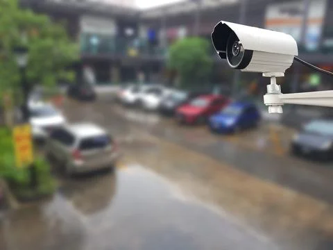 CCTV Camera on abstract blur packing car for background. Stock Photos