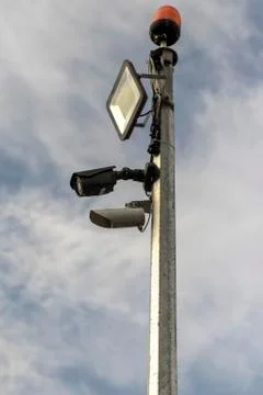 CCTV camera on blue sky background. Foto stock