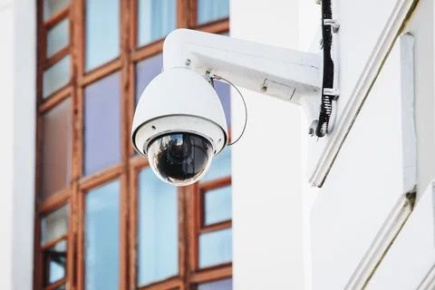 CCTV camera on the building, security surveillance outdoor camera Stock Photos