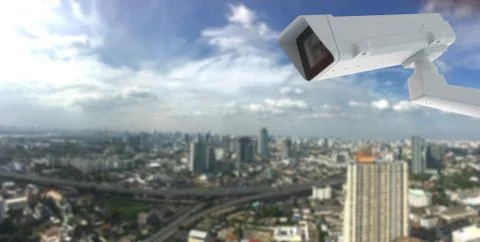 Cctv camera with city in background Stock Photos