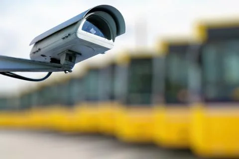 CCTV camera concept with bus warehouse in background Stock Photos