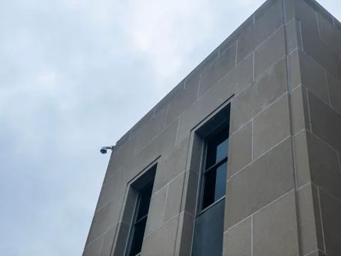 CCTV camera on the corner of building Stock Photos