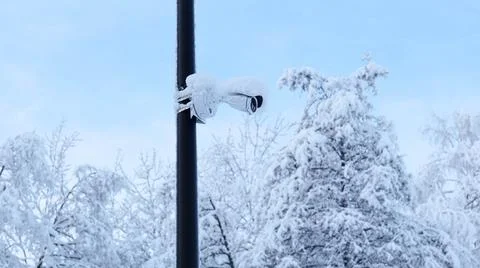 CCTV Camera Covered with Snow Close-up on the Left Stock Photos