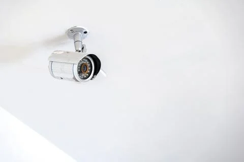 Cctv camera hang on to ceiling in the office, Thailand. Stock Photos