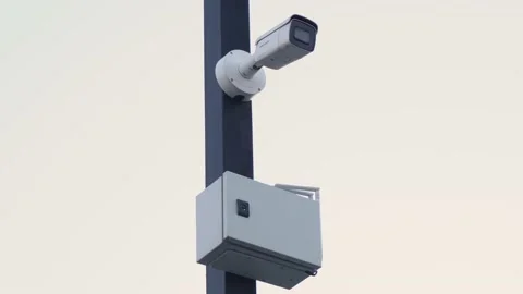 CCTV camera hanging on a street pole Video stock 166561586