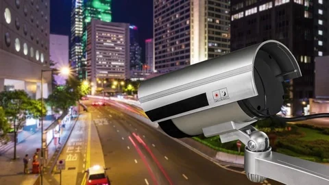 CCTV camera has focus and recording a car on the road with traffic jam at night 스톡 동영상 83065699