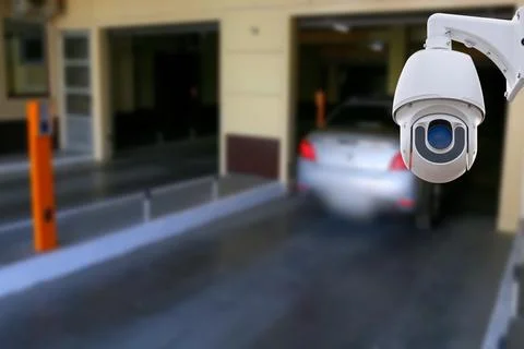 Cctv camera installed on the parking lot to protection security. Copy space. Stock Photos