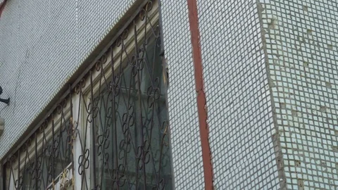 CCTV camera located on the wall of the school building Stock Footage 75445771