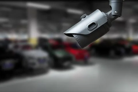 CCTV Camera Operating in car park building. Copy space. Stock Photos