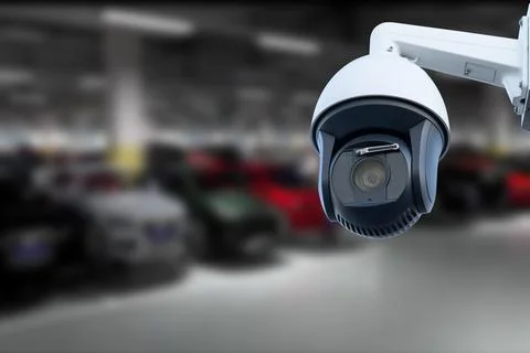CCTV Camera Operating in car park building. Copy space. Stock Photos