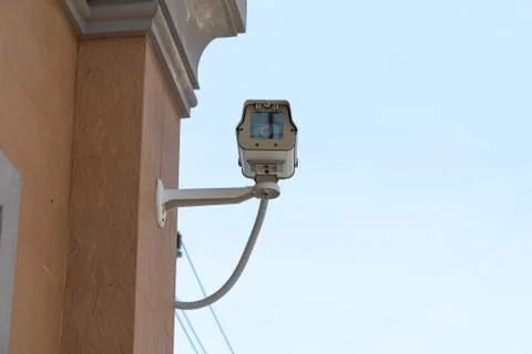 CCTV camera or outdoor security cameras on a wall, video protection safety sy Stock Photos
