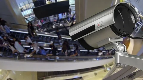 CCTV camera or surveillance operating with escalator and moving people Video stock 81572387