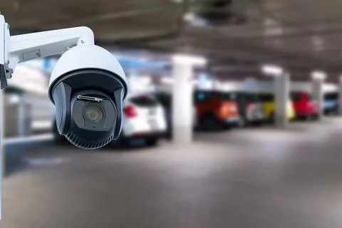 CCTV camera or surveillance system on indoor car parking. Stock-Fotos