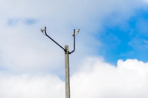 Cctv camera on pole with blue sky Stock Photos