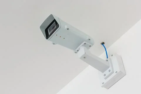 CCTV camera. Security camera on the white wall. Private property protection. Stock Photos