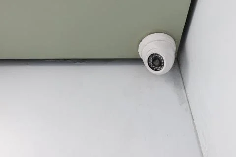 Cctv camera security installed on ceiling for safety concept Stock Photos