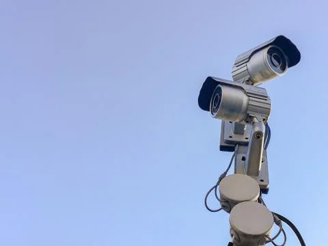 Cctv camera security on pole and cement background Stock Photos