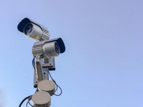 Cctv camera security on pole and cement background Stock Photos
