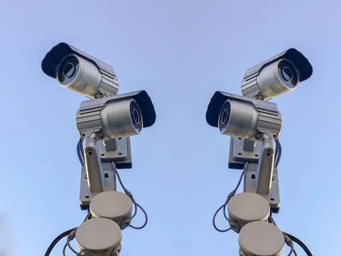 Cctv camera security on pole and cement background Stock Photos