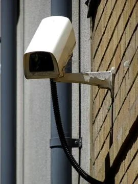 CCTV Camera On Side Of Building Stock Photos