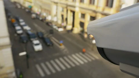 CCTV camera spying on people and cars Stock Footage