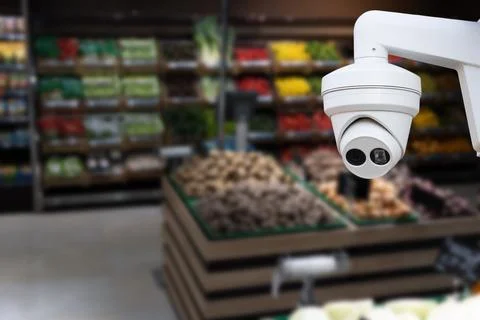 CCTV camera system security in shopping mall supermarket blur background Stock Photos