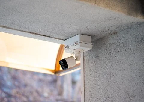 CCTV camera on white background with home security system concept Stock Photos