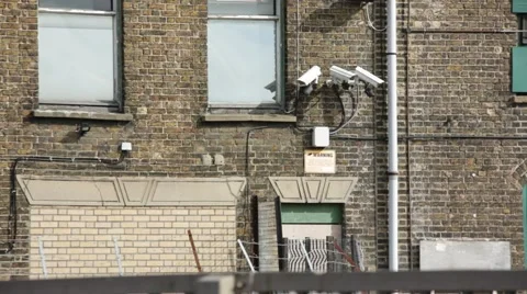 CCTV cameras on the side of the warehouse wall in England, Europe Stock Footage 58732126