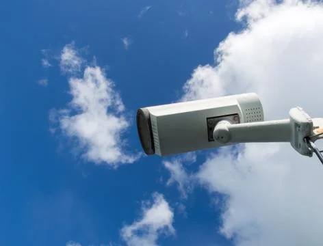 CCTV cameras on sky background. Photos