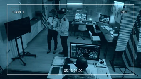CCTV of Diverse Officers Working with Intelligence Data in Command Center Stock Footage 297938756