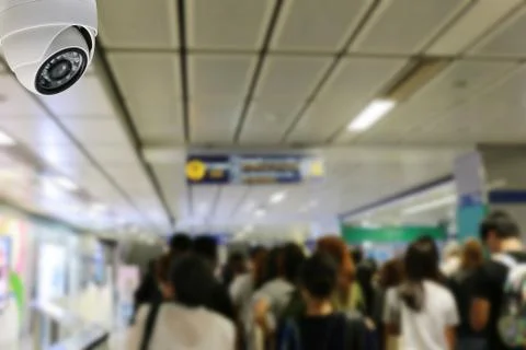 CCTV dome on the ceiling in the metro area. Stock Photos