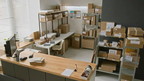 CCTV of Express Delivery Office with Racks of Parcels and Service Counter Stock Footage 321434298