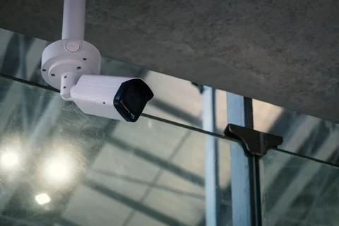 CCTV, indoor security camera on ceiling of modern building Stock Photos