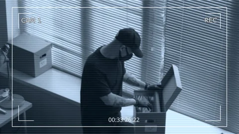 CCTV of Male Thief Hacking into Office Computer while Partner Searching for Data Stock Footage 313550287