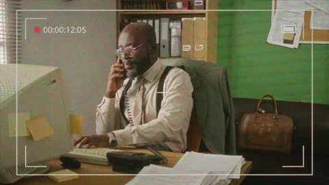 CCTV of Man Talking on Retro Phone, Typing on Computer Stock Footage 341416746