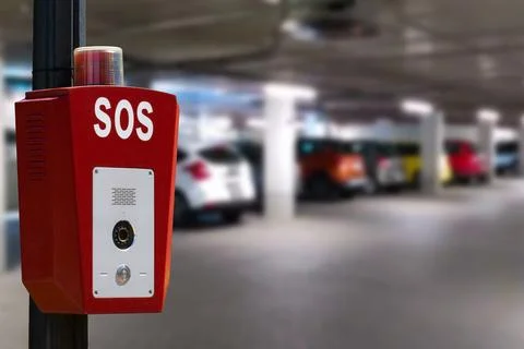 CCTV security camera on blur car parking.Parking security system. Stock Photos