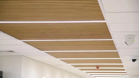 CCTV security camera on ceiling, operating inside the building Video stock 253666516