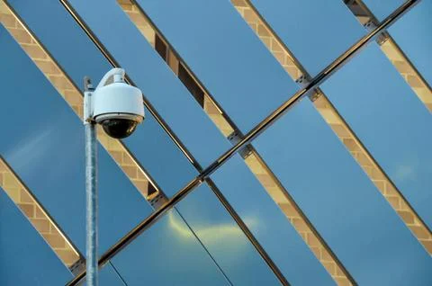 CCTV Security camera in front of metallic structure Stock Photos