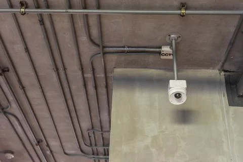 CCTV Security Camera on Industrial Ceiling Stock Photos