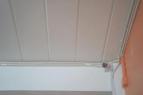 CCTV security camera installed on ceiling building Stock Photos
