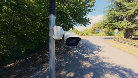 CCTV Security Camera Mounted on Pole Watching Outdoor Road in Park Stock Footage 346691207
