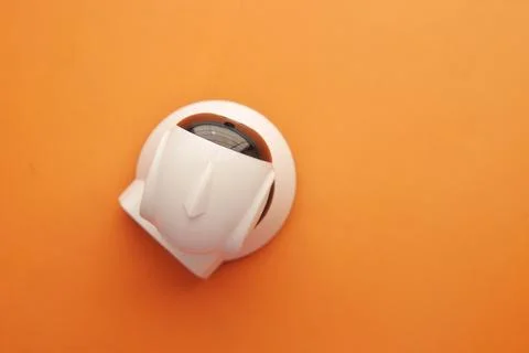 CCTV security camera operating on light orange background Stock Photos