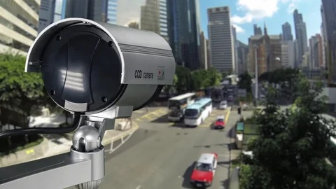 CCTV Security Camera or surveillance operating on traffic road and urban scene. Video stock 82959617