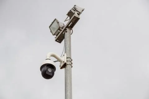 CCTV security camera on pole watching the area Stock Photos