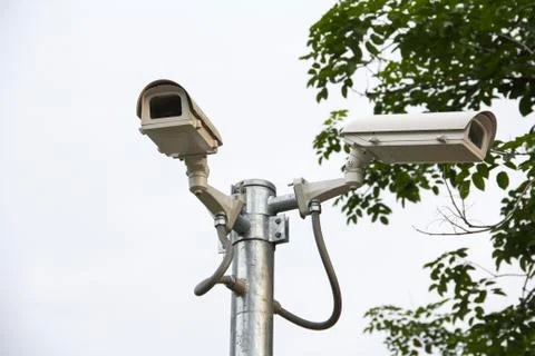 Cctv security camera  on the road in the town Stock Photos