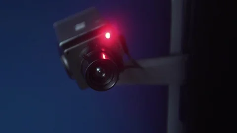 Cctv Security Camera Rotates At Night Indoors, 4K Spy Surveillance Stock Footage 108543255